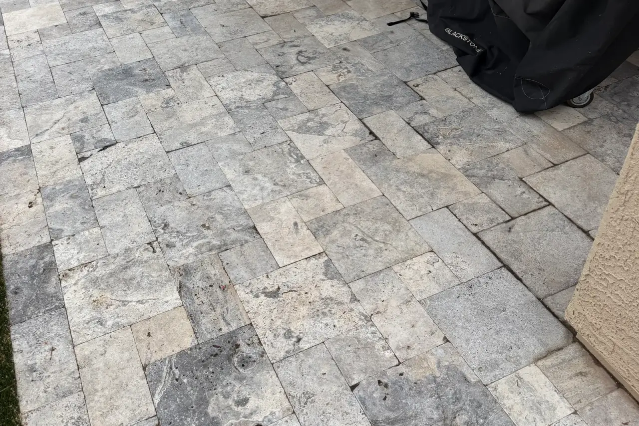 Travertine pool deck and patio cleaned to a bright, even finish in the East Valley