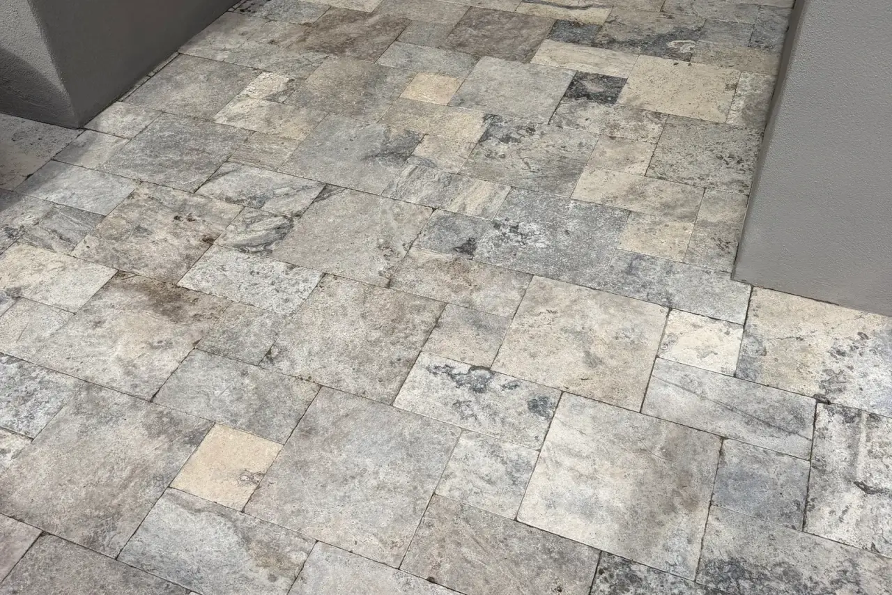 Outdoor kitchen travertine floor cleaned spotless in Gilbert, Arizona