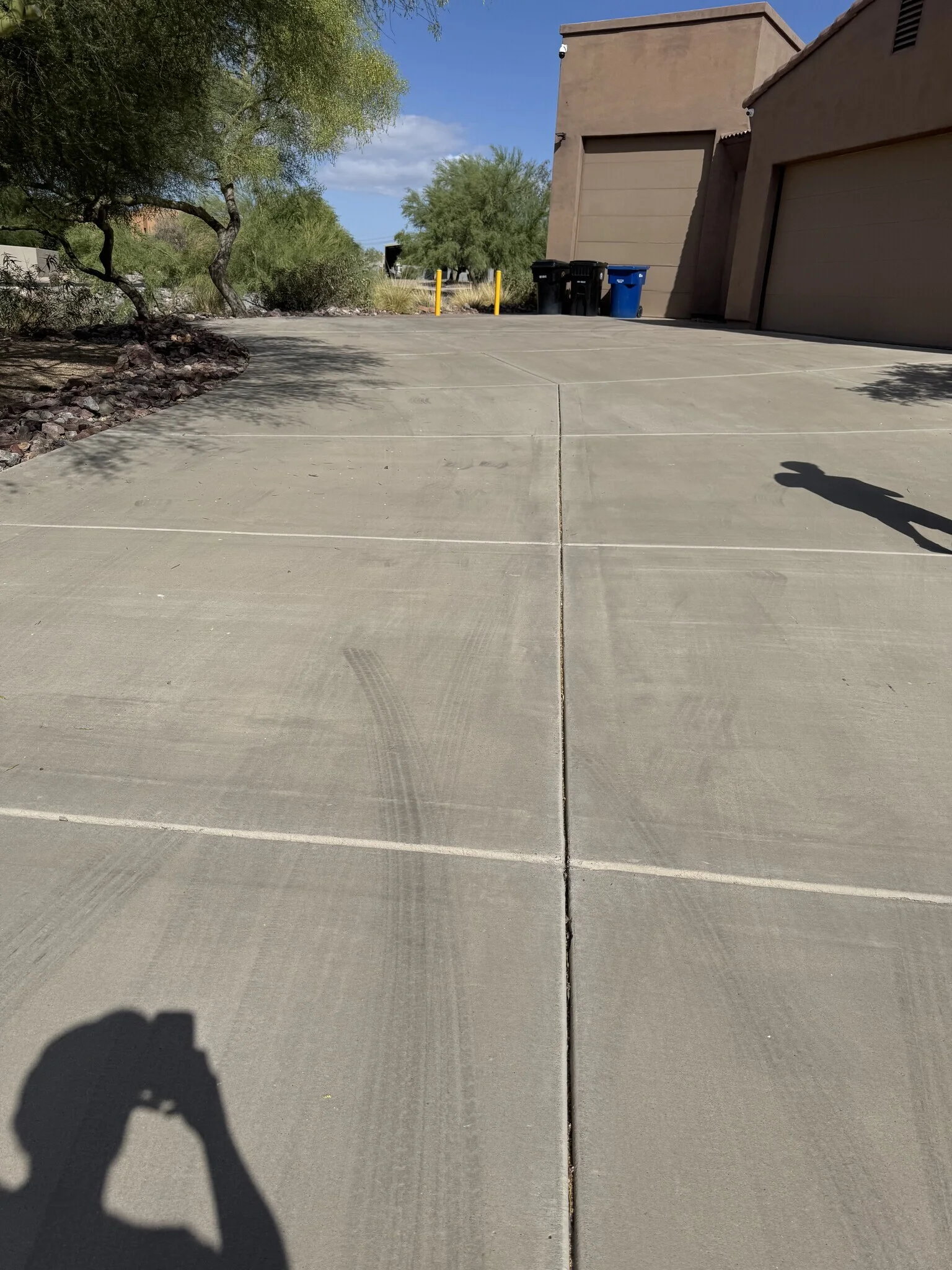 Pressure washing mist drifting across Arizona property
