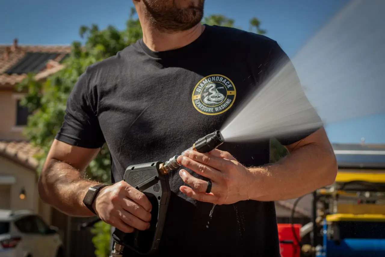 Diamondback technician pressure washing a Chandler property